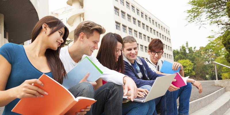 Medium multinational students sitting