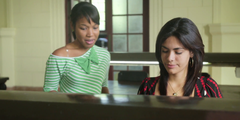 Medium young people at school female students studying and doing homework in college library njayzl0f  f0000