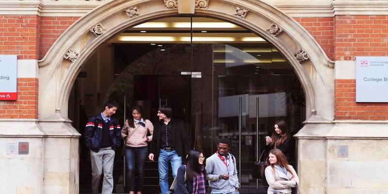 Medium into cty students outside college building hero